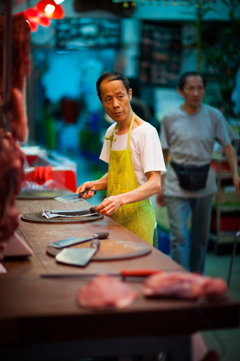Colour photo of a man cooking food in a restaurant