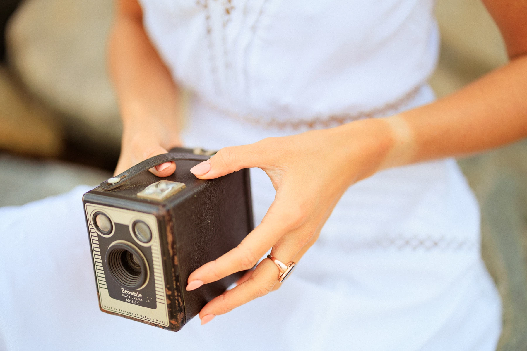 Colour photo of a person holding a black device
