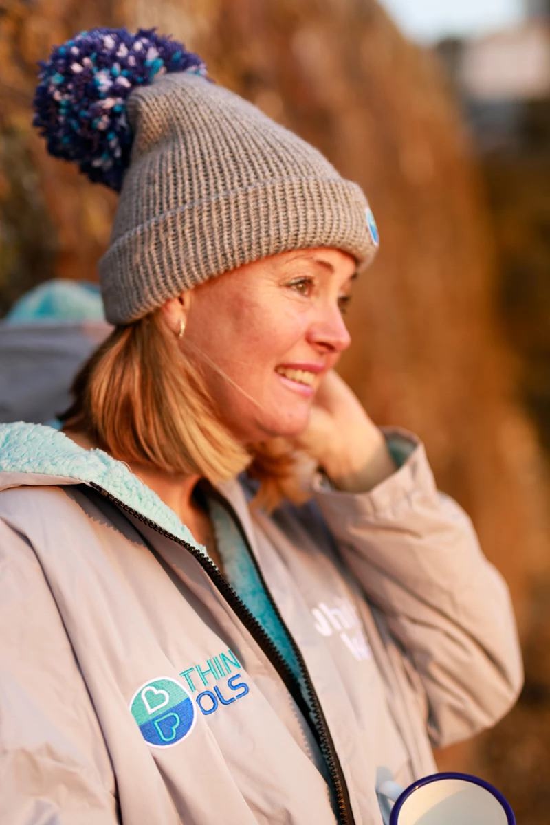 Colour photo of a person wearing a hat
