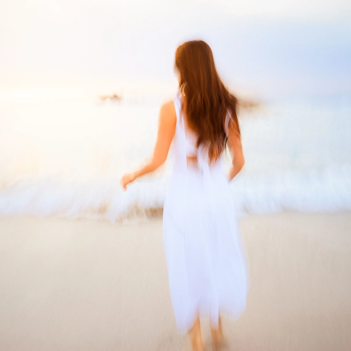 Colour photo of a person in a white dress