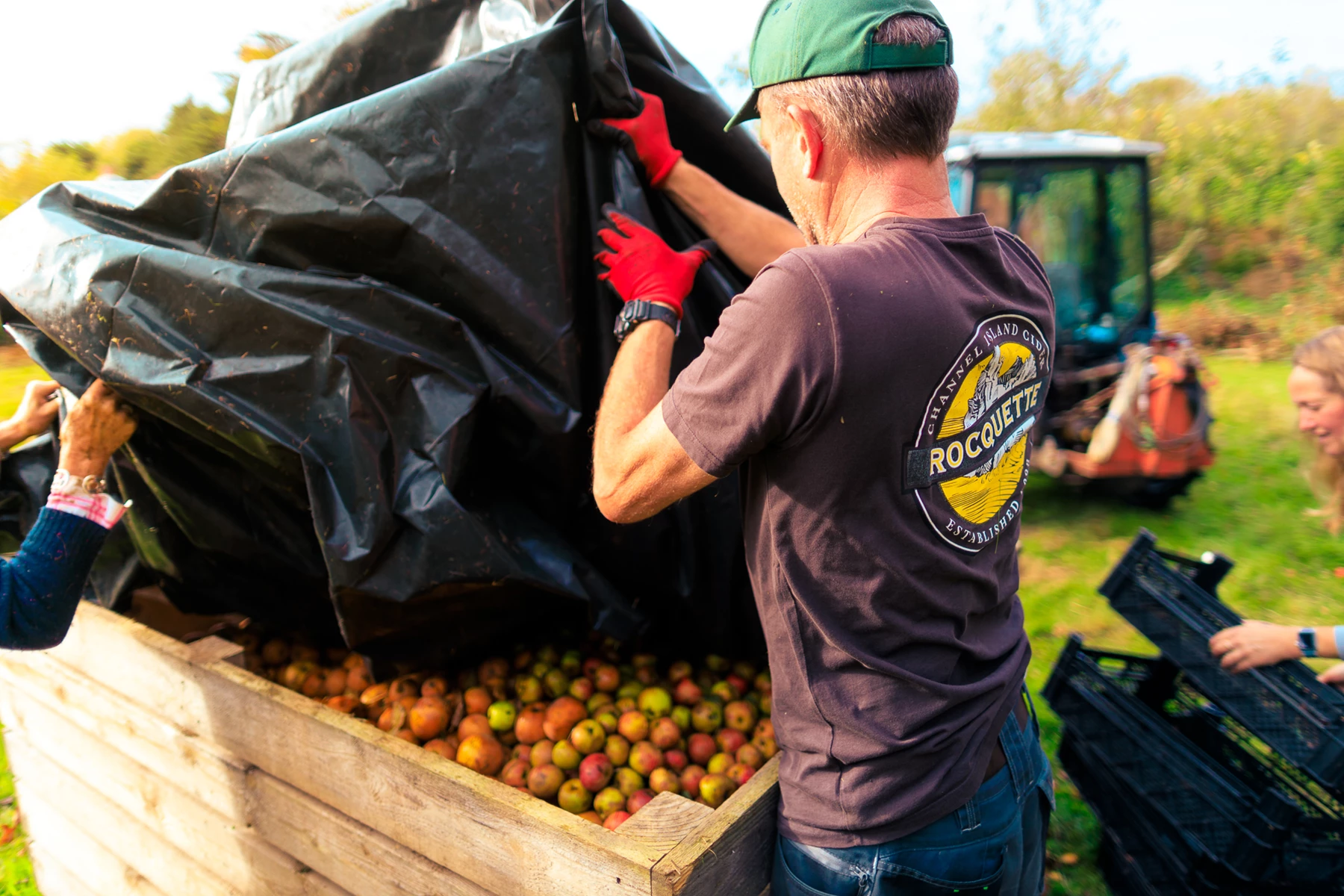 Colour photo of a man holding a bag of fruit