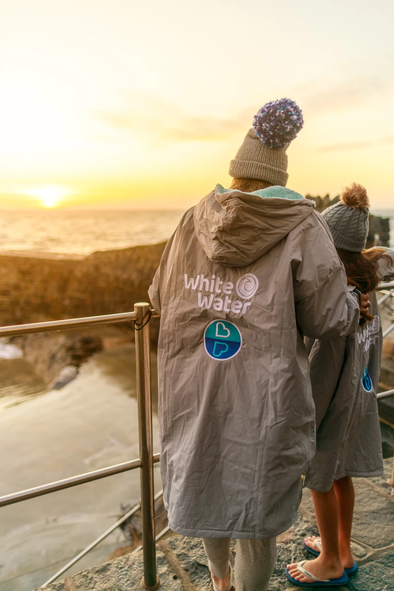 Colour photo of a group of people wearing coats