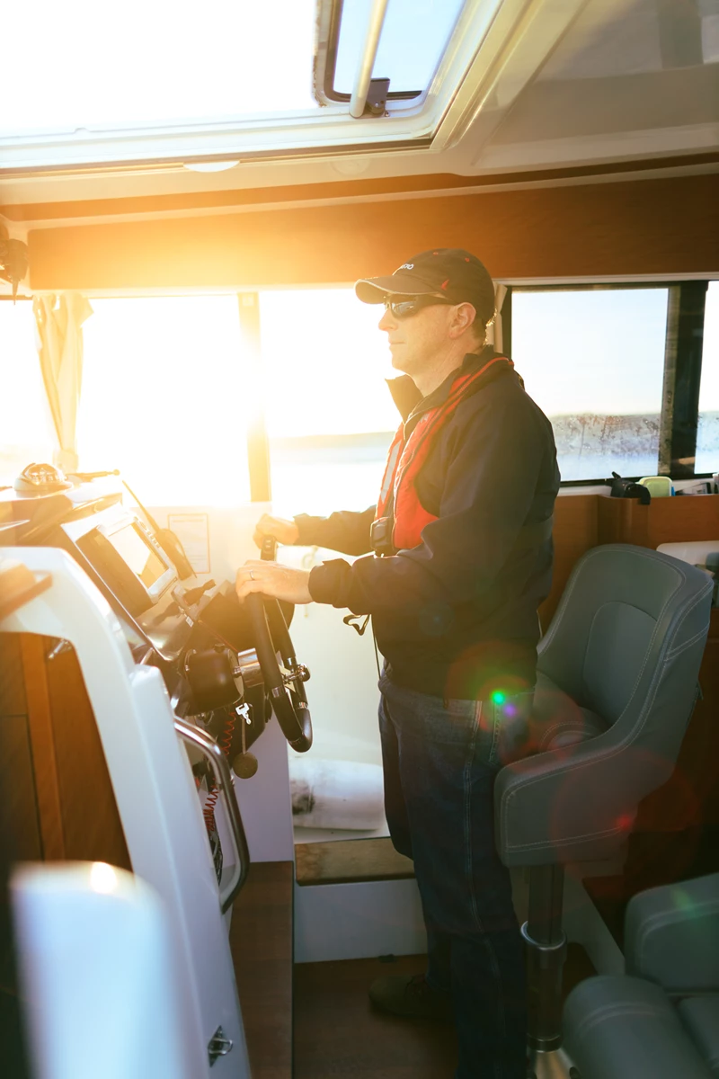 Colour photo of a person in a vehicle