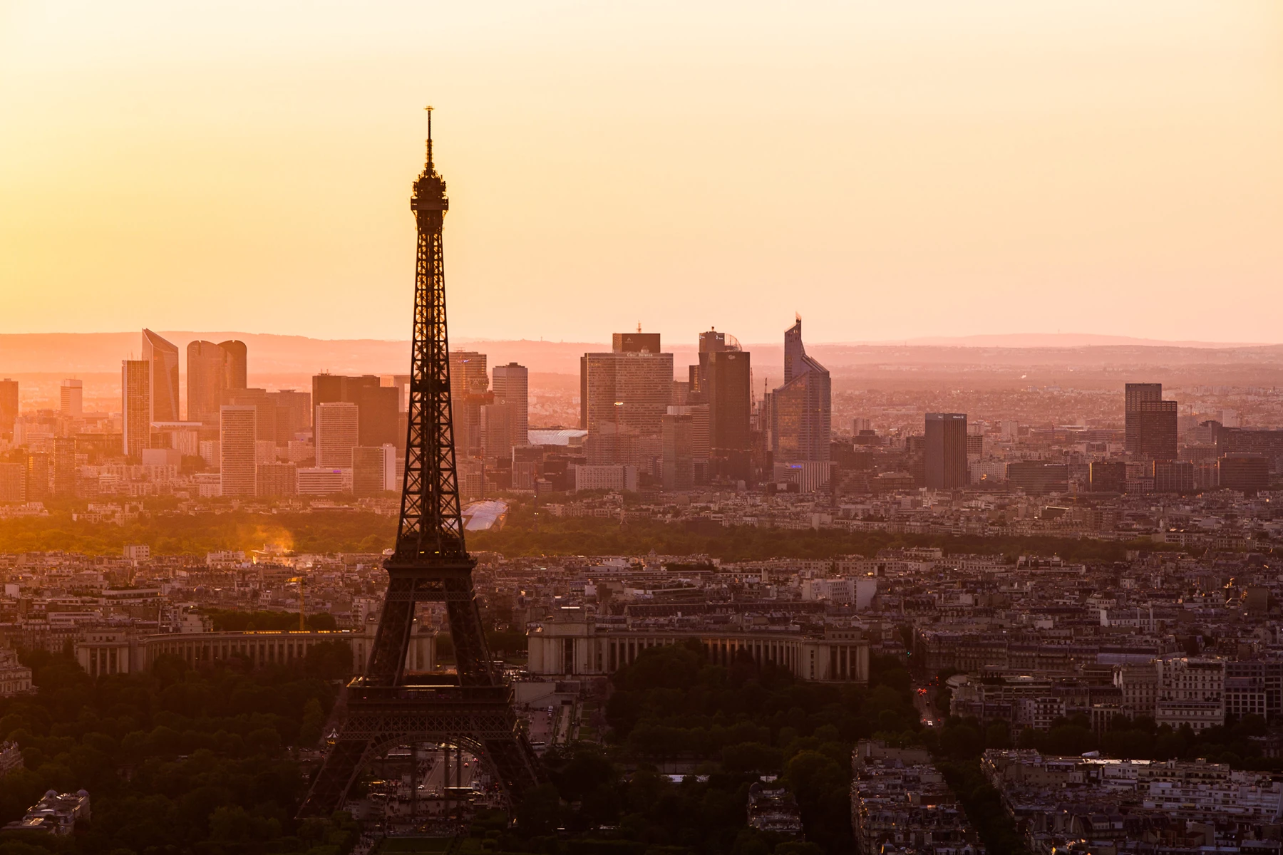 Travel landscape photo of Eifel Tower and Paris skyline at dusk with sunset sky