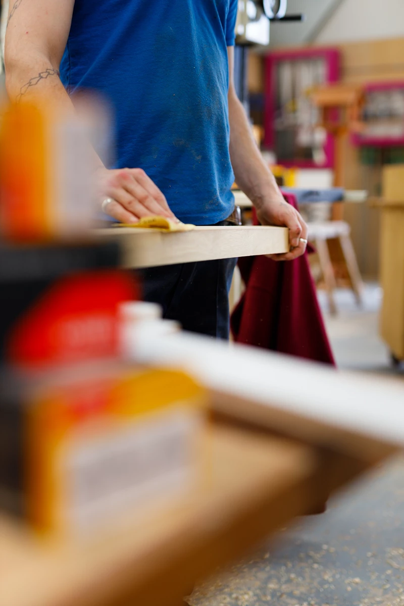 Colour photo of a person holding a piece of paper