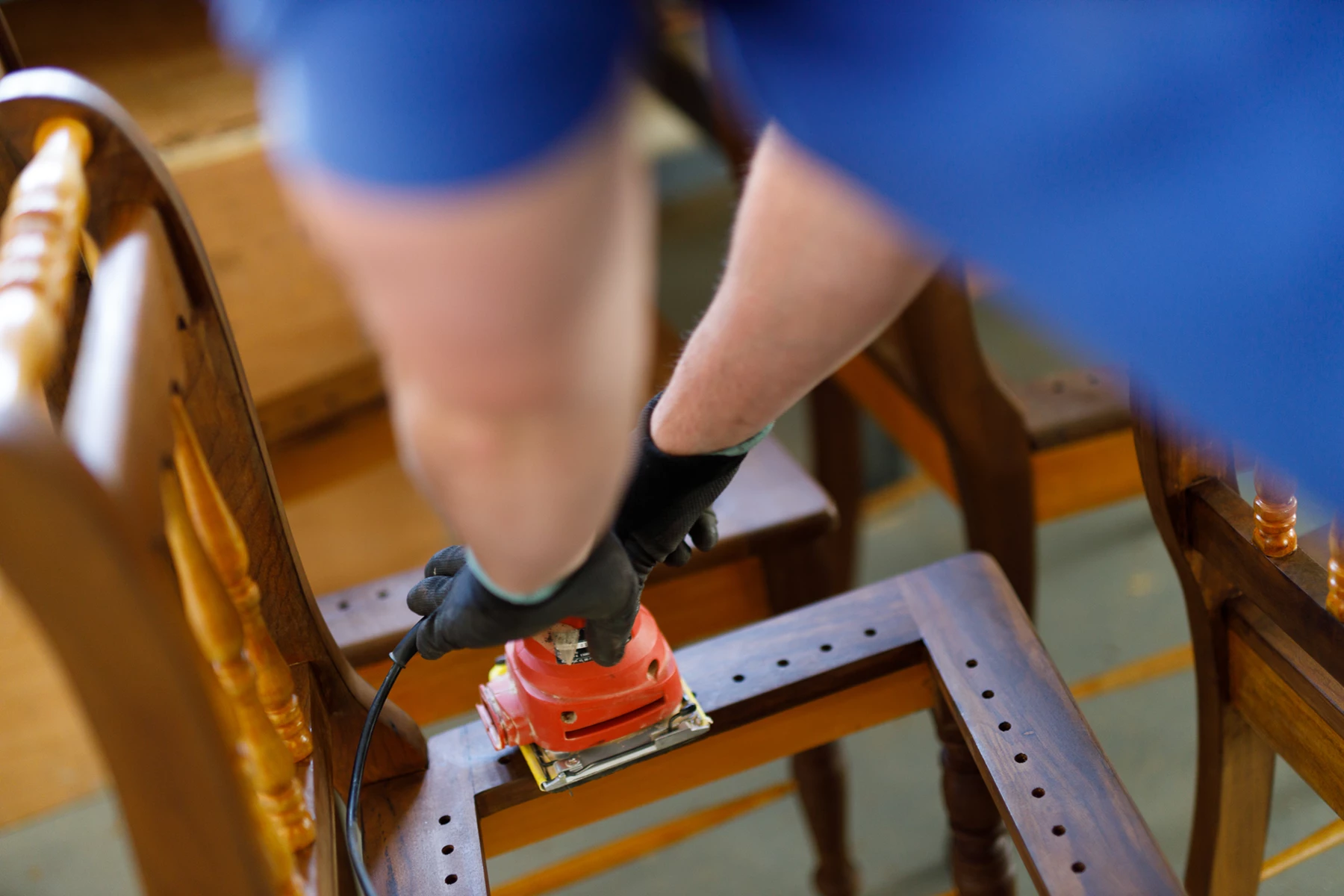 Colour photo of a person working on a machine