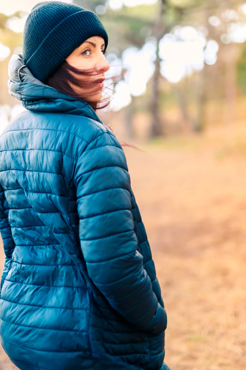 Colour photo of a person wearing a blue coat