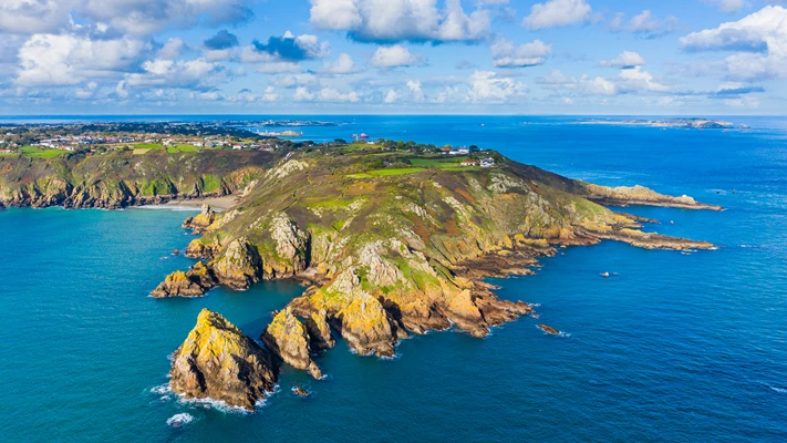 Aerial drone photo of Guernsey cliffs with Pea Stacks and Jerbourg Point