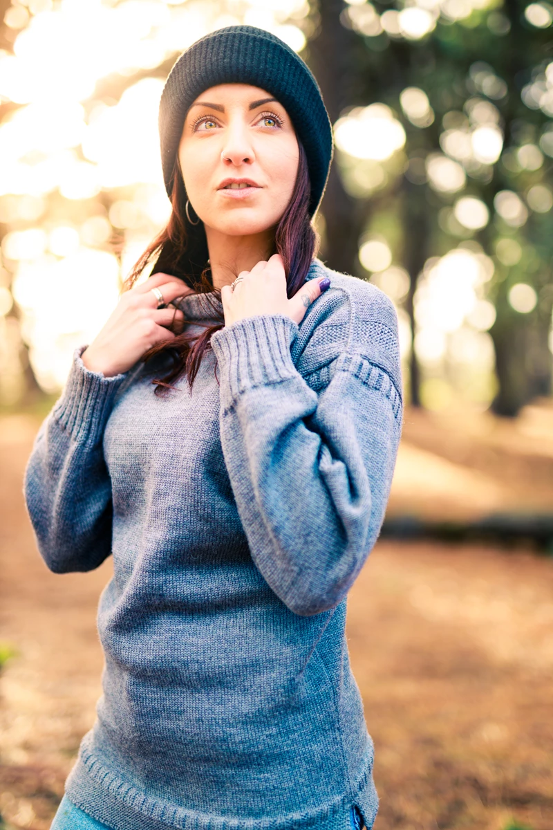 Colour photo of Nay Firens in a blue sweater