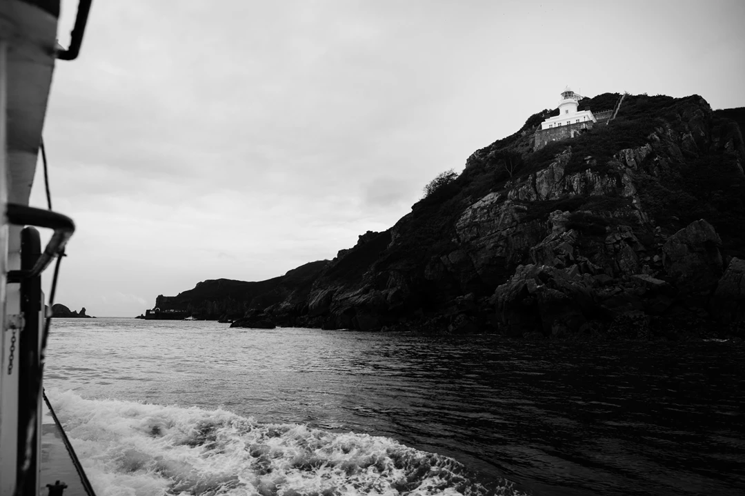 Black & white photo of a boat on the water