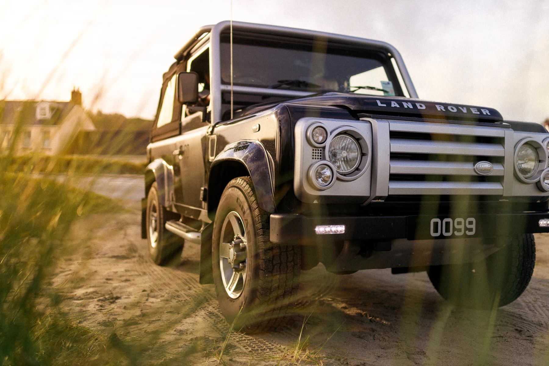 Colour photo of a truck on a dirt road