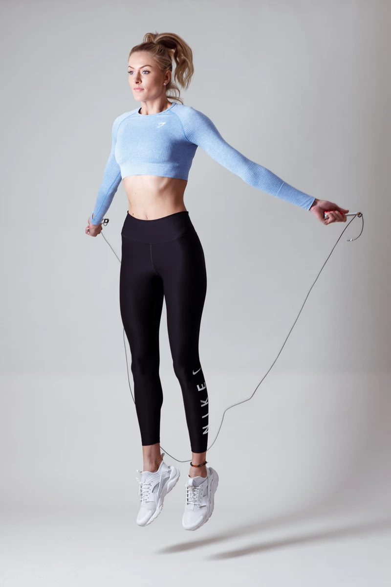 Colour photo of a person holding a rope