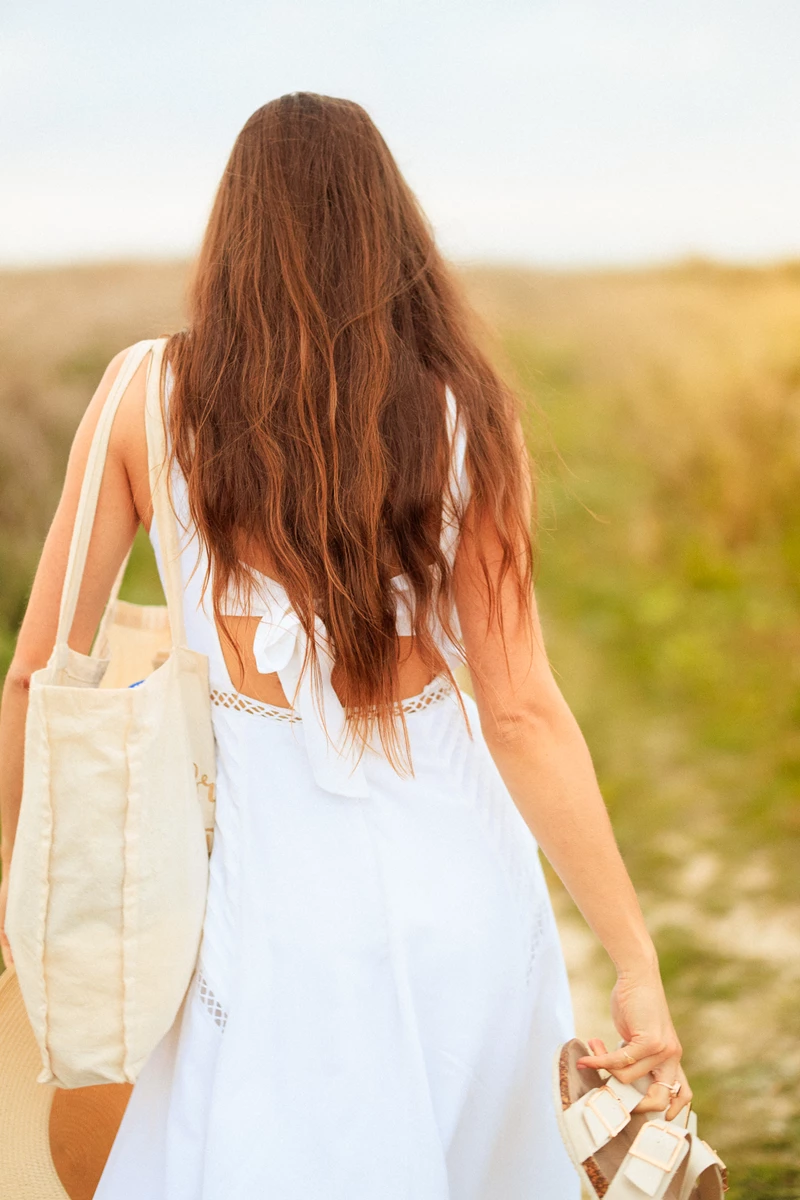 Colour photo of a person wearing a white dress