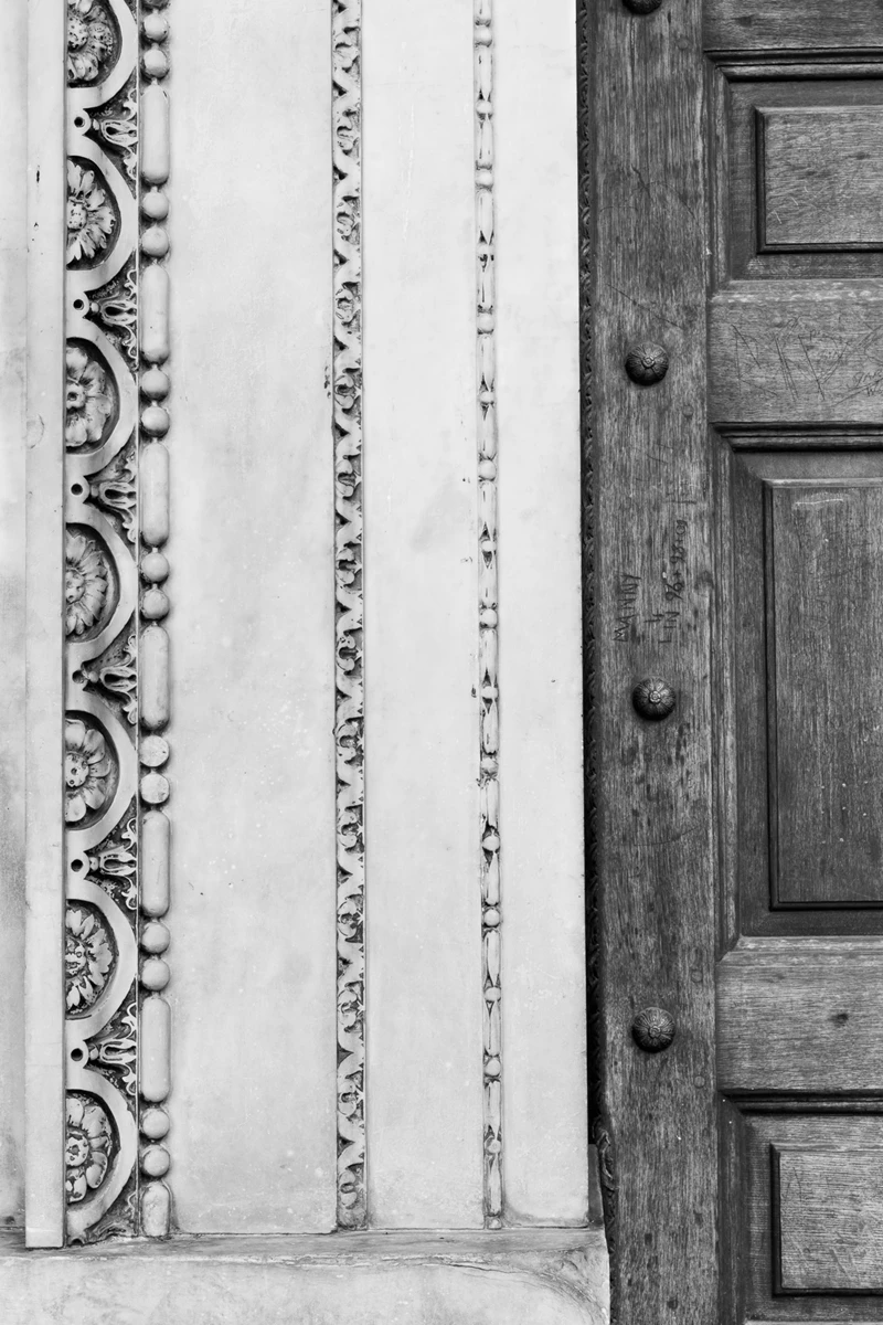 Black & white photo of a door with a design on it