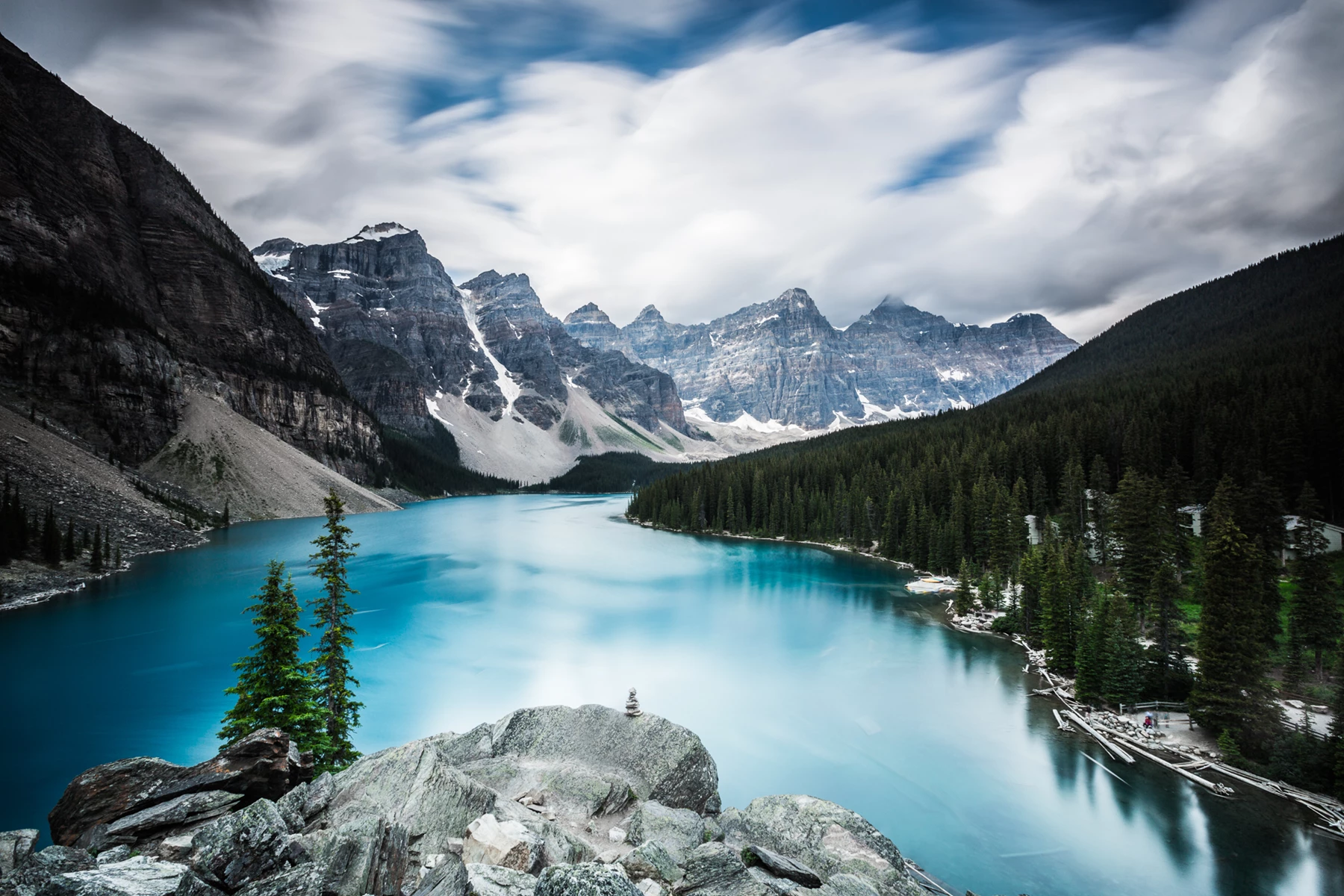 Colour photo of a lake surrounded by mountains