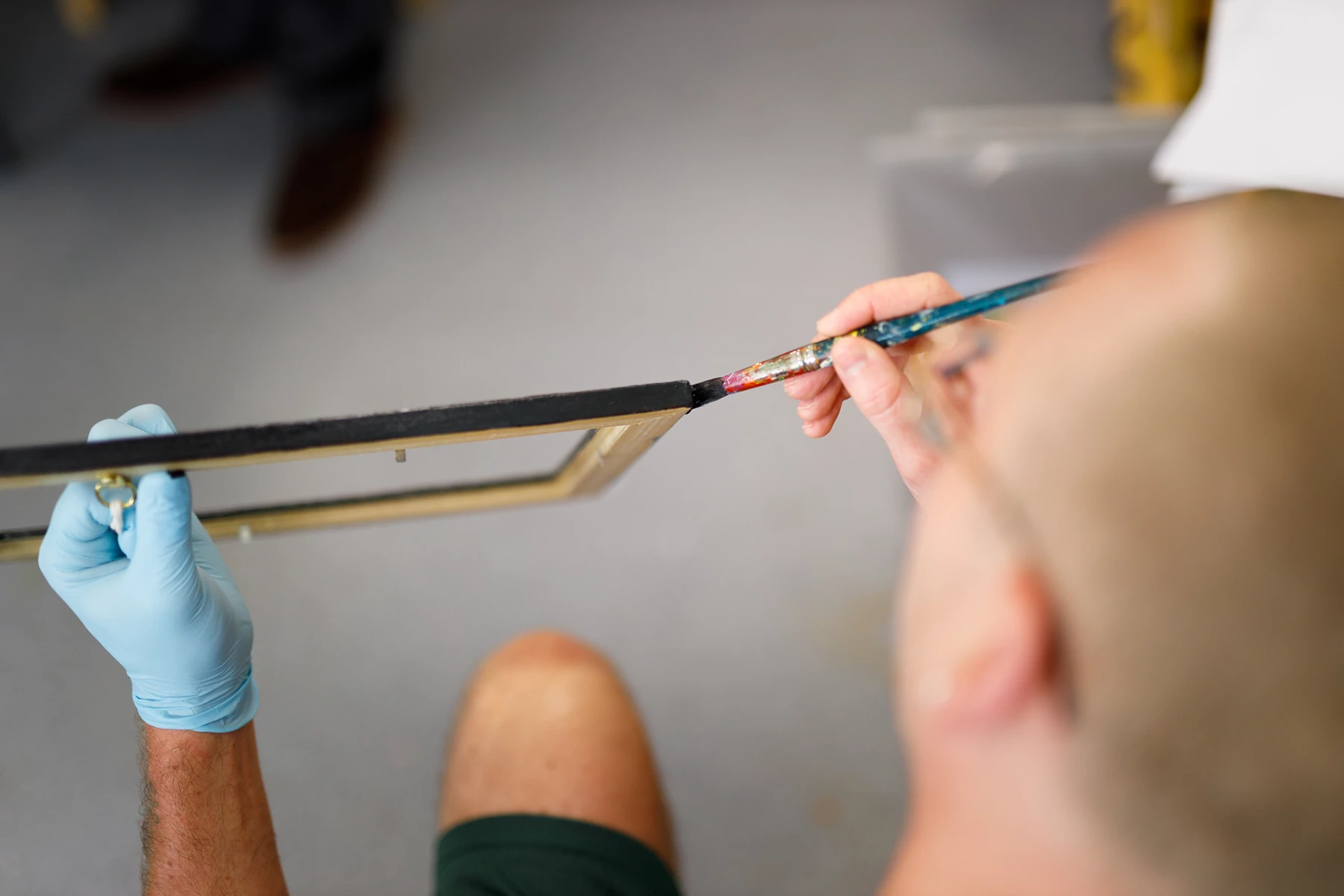 Colour photo of a person holding a syringe