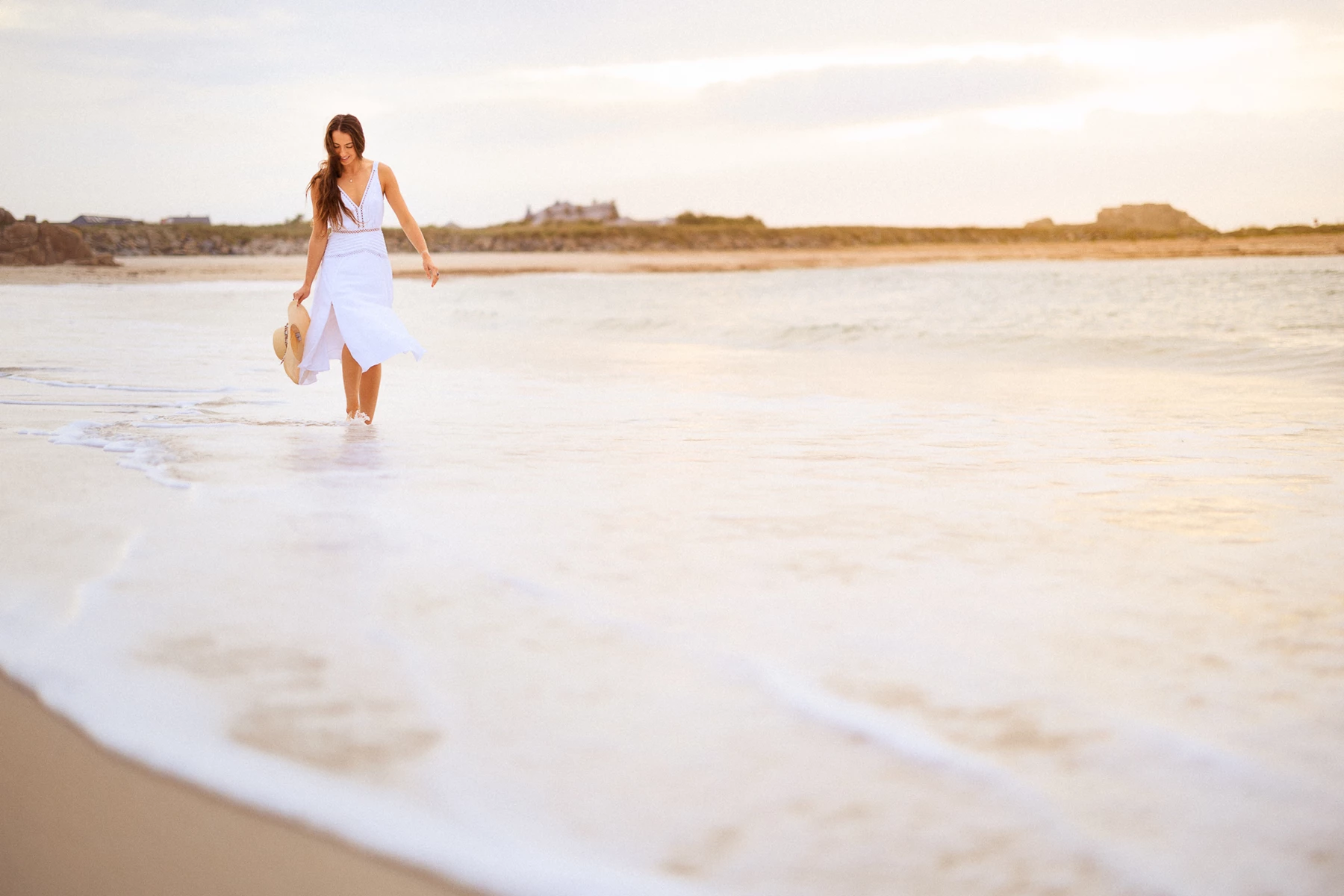 Colour photo of a person walking in the water