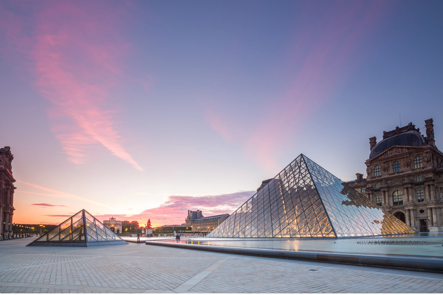 Colour photo of a bridge over water with buildings on the side