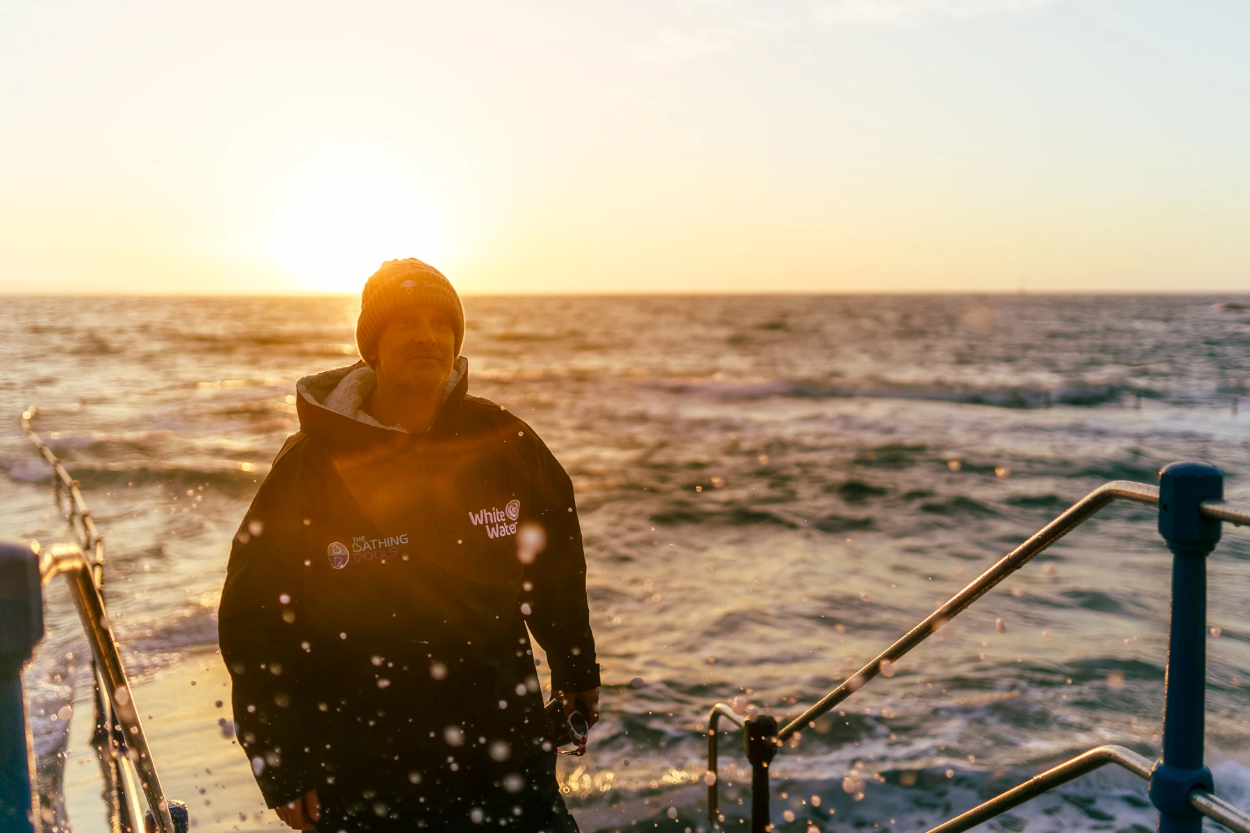 Colour photo of a person standing on a boat