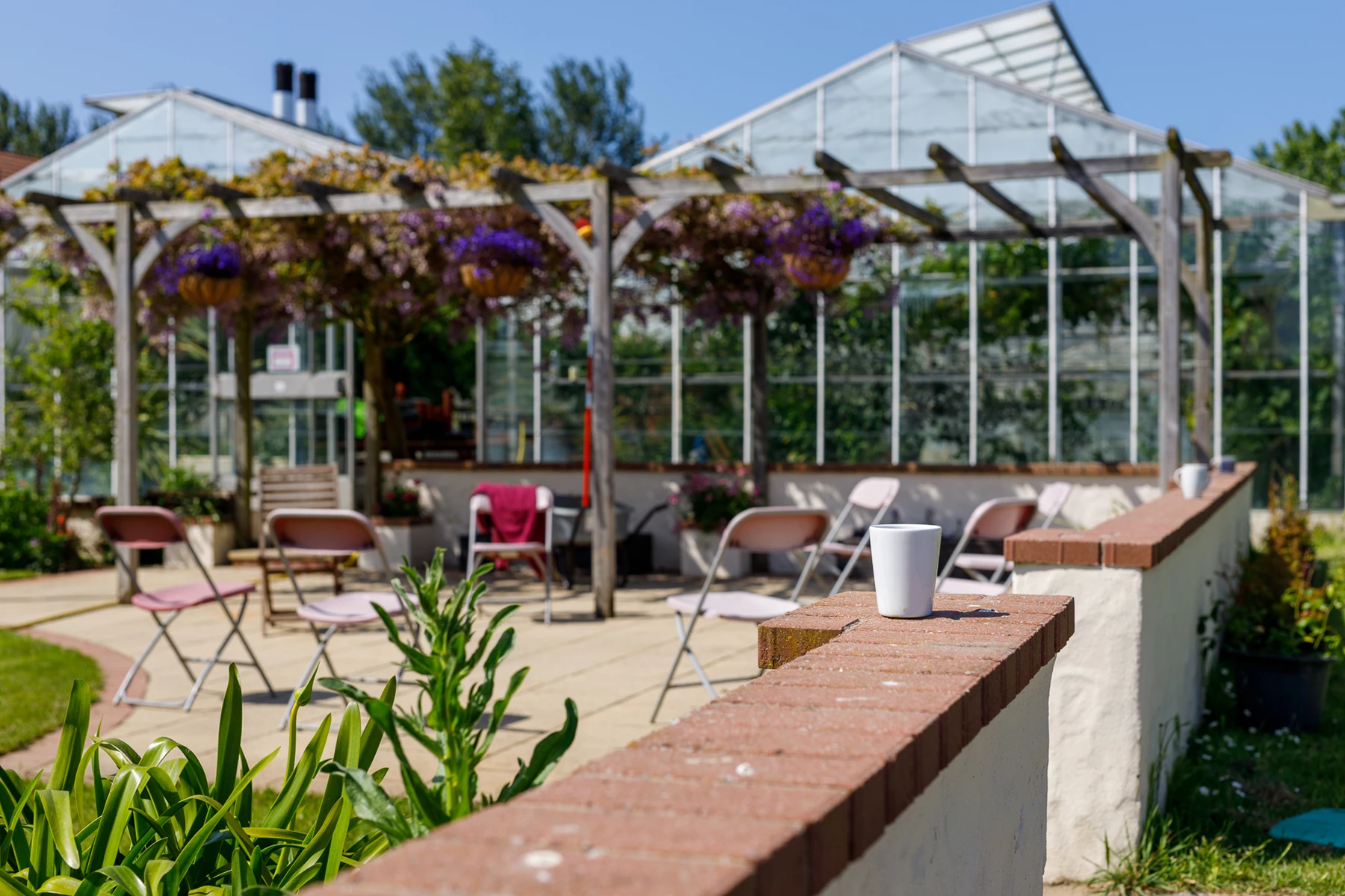 Colour photo of a patio with tables and chairs