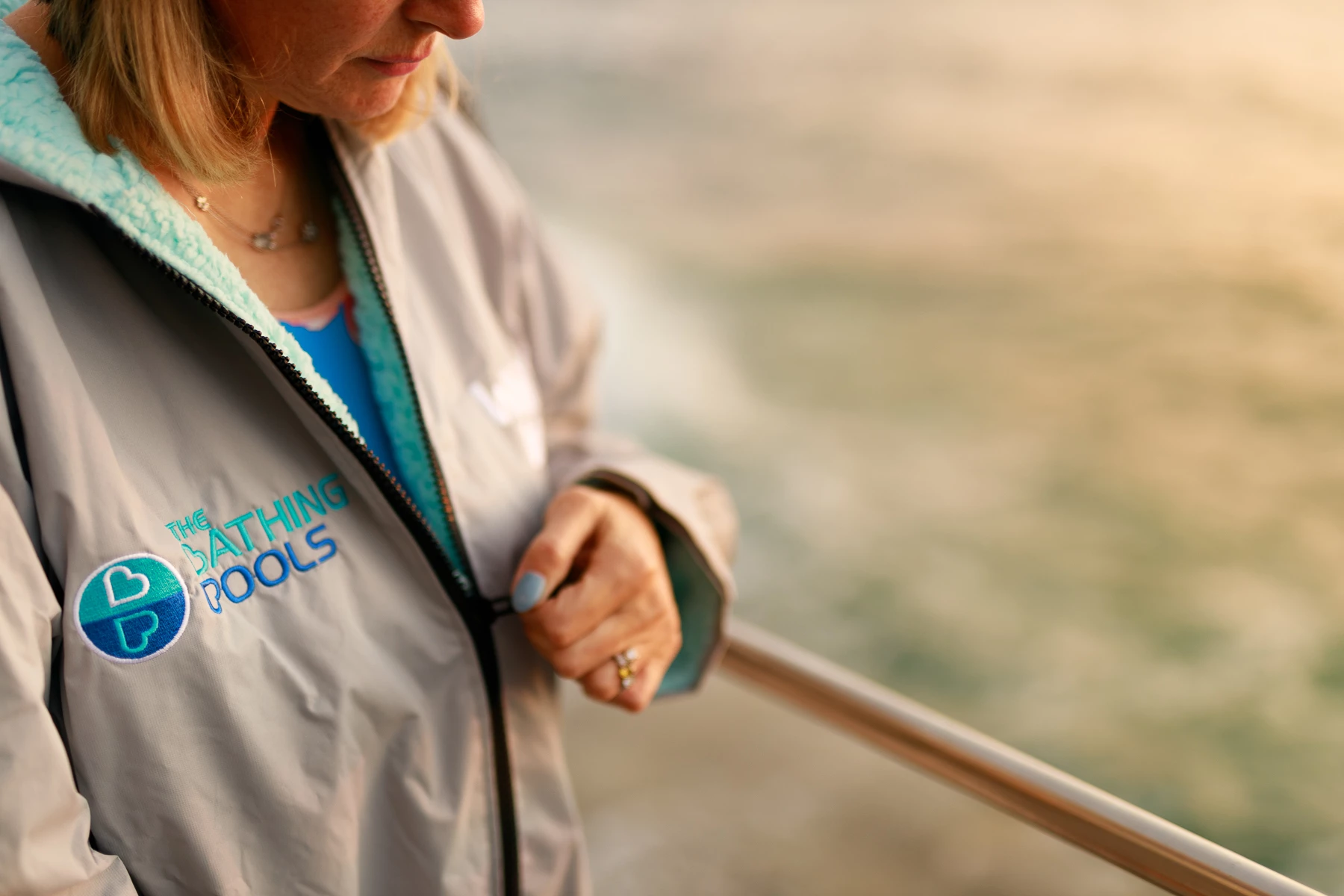 Colour photo of a person holding a cup