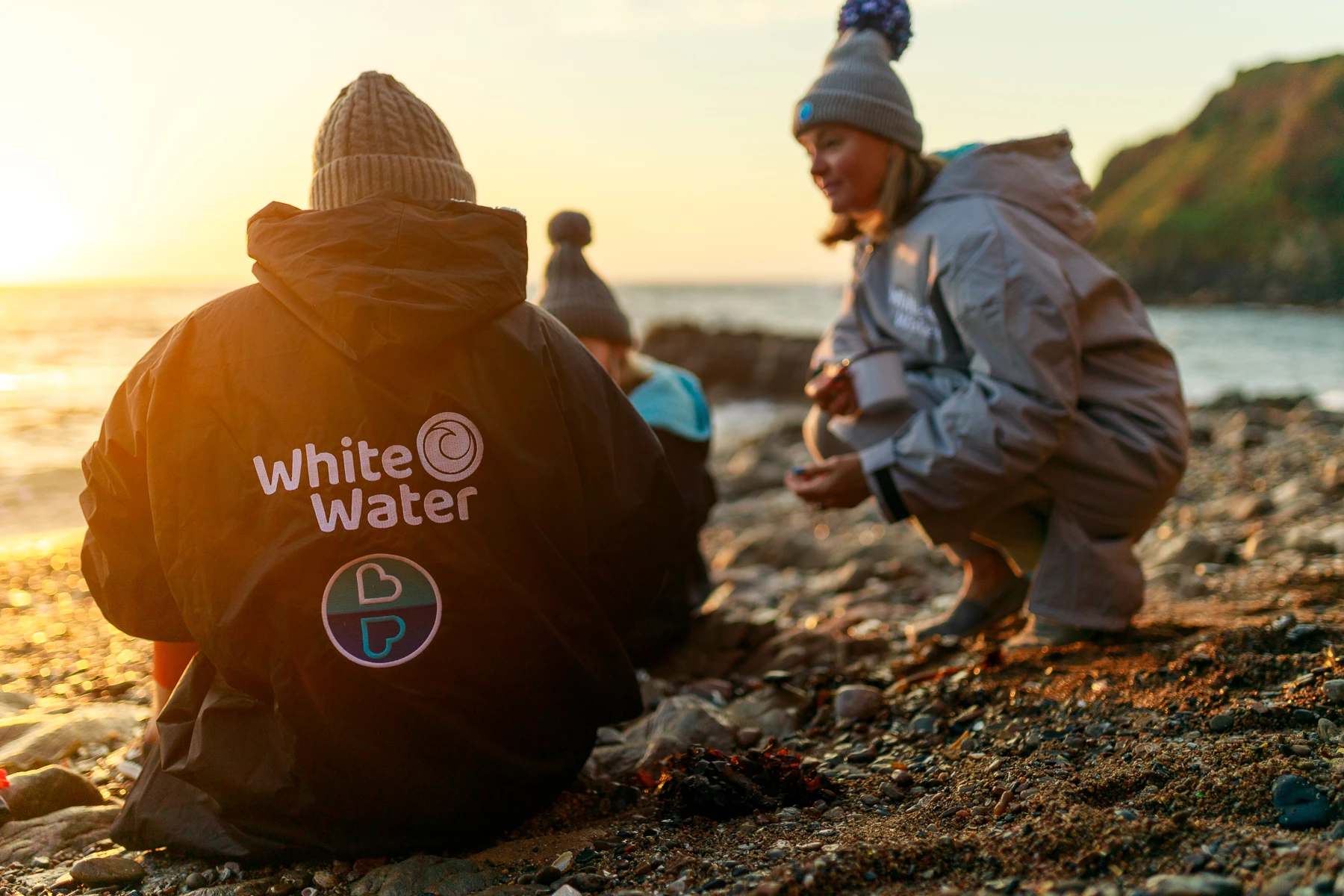 Colour photo of a man and a child on a beach