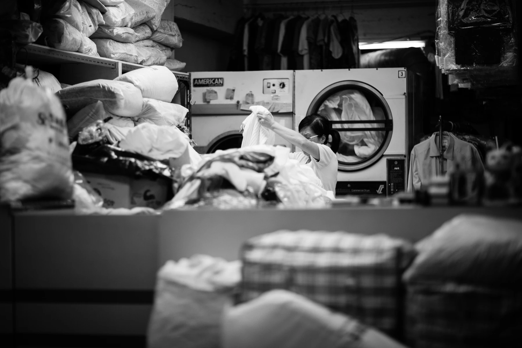 Black & white photo of a person in a hospital bed