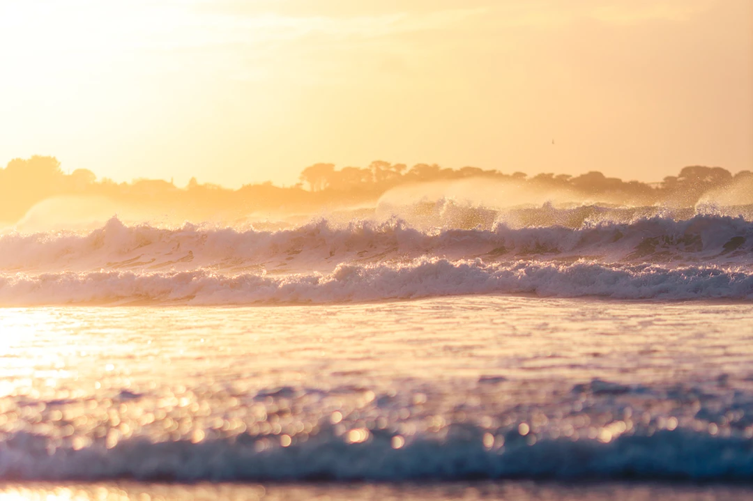 Colour photo of a body of water with clouds above