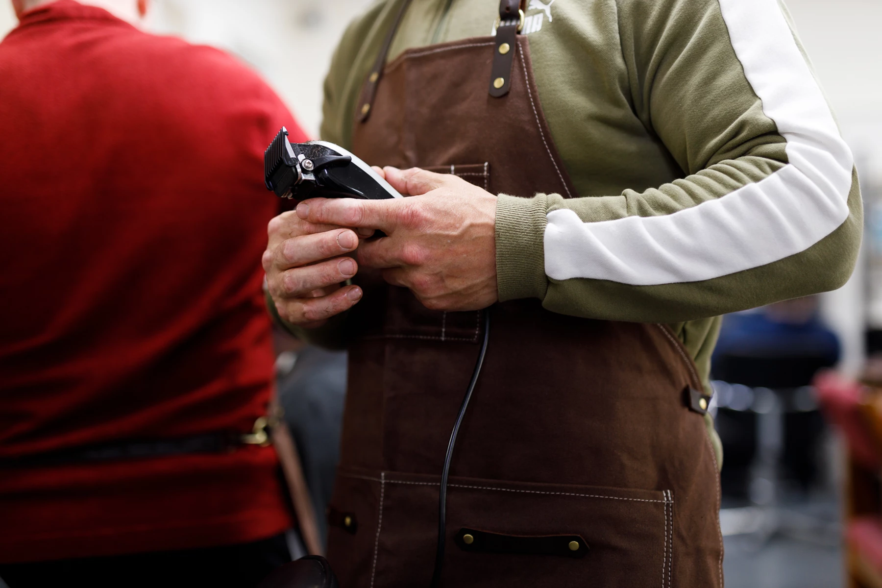 Colour photo of a person holding a phone