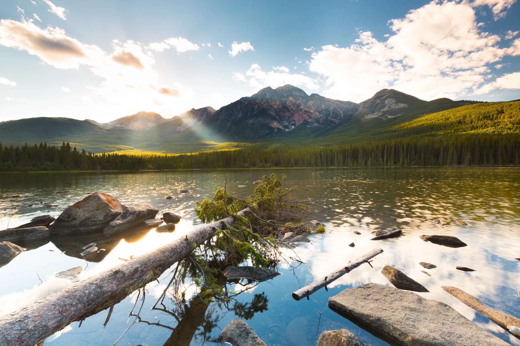 Colour photo of a lake with mountains in the background