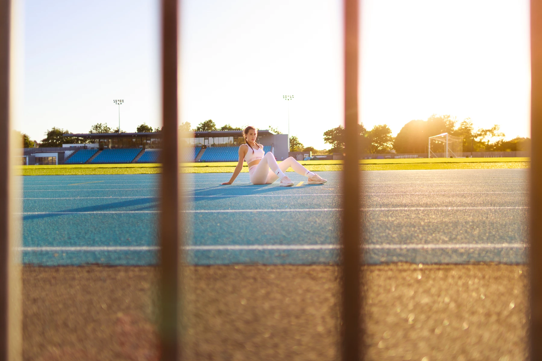 Colour photo of a person sitting on a track
