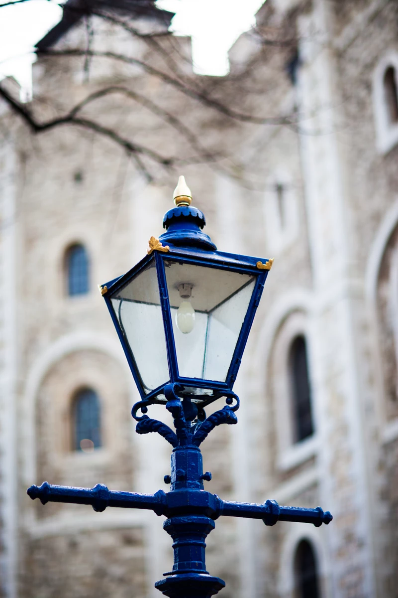 Colour photo of a lamp post in front of a building