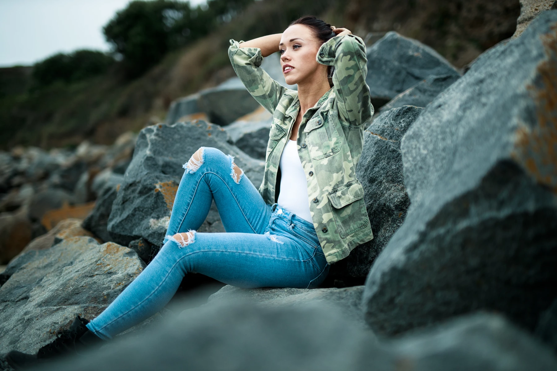 Lifestyle photo of woman sitting on beach