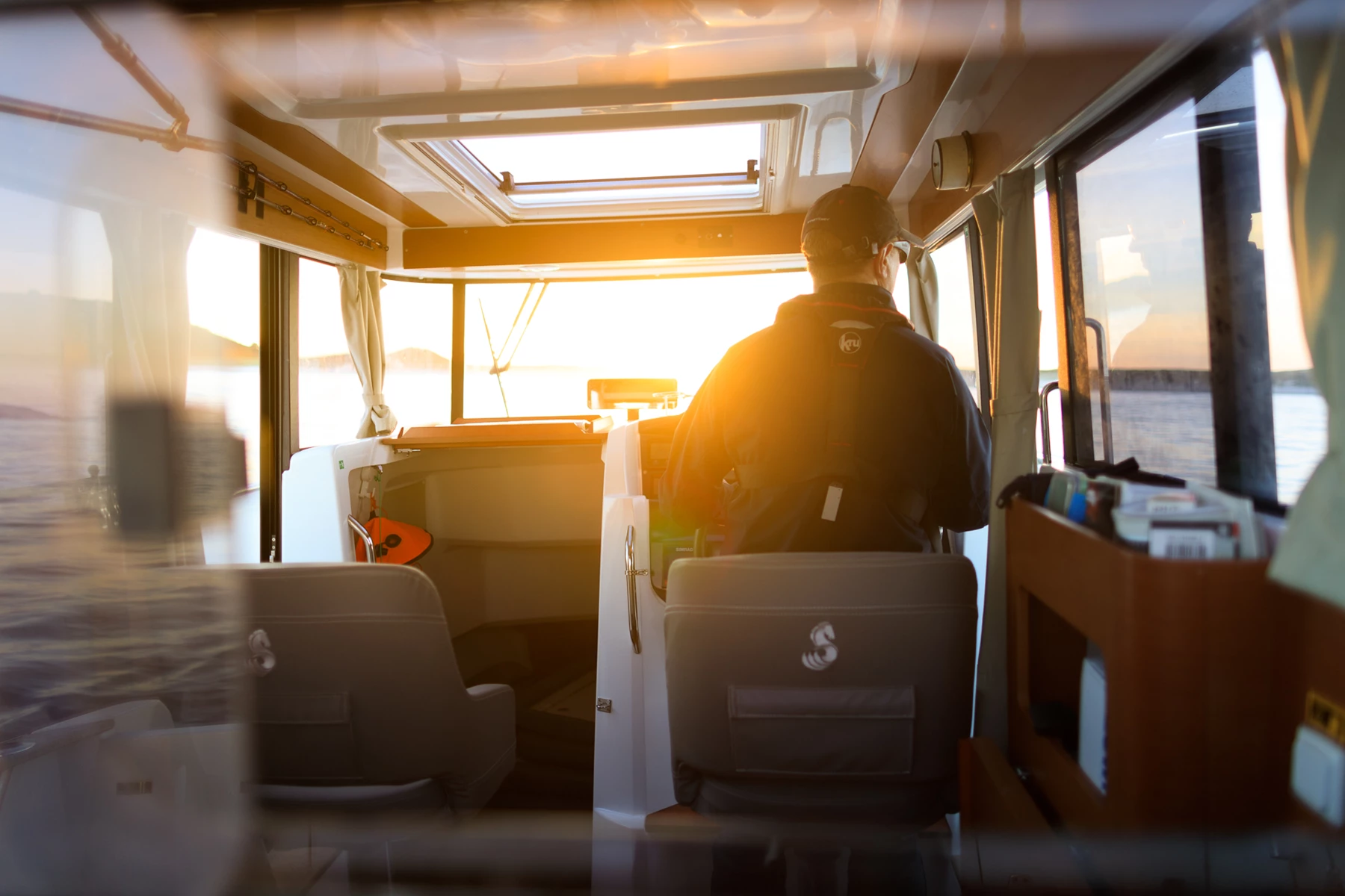 Colour photo of a person sitting on a bus