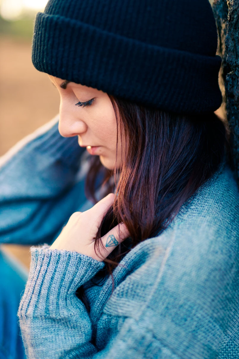 Colour photo of a person wearing a hat