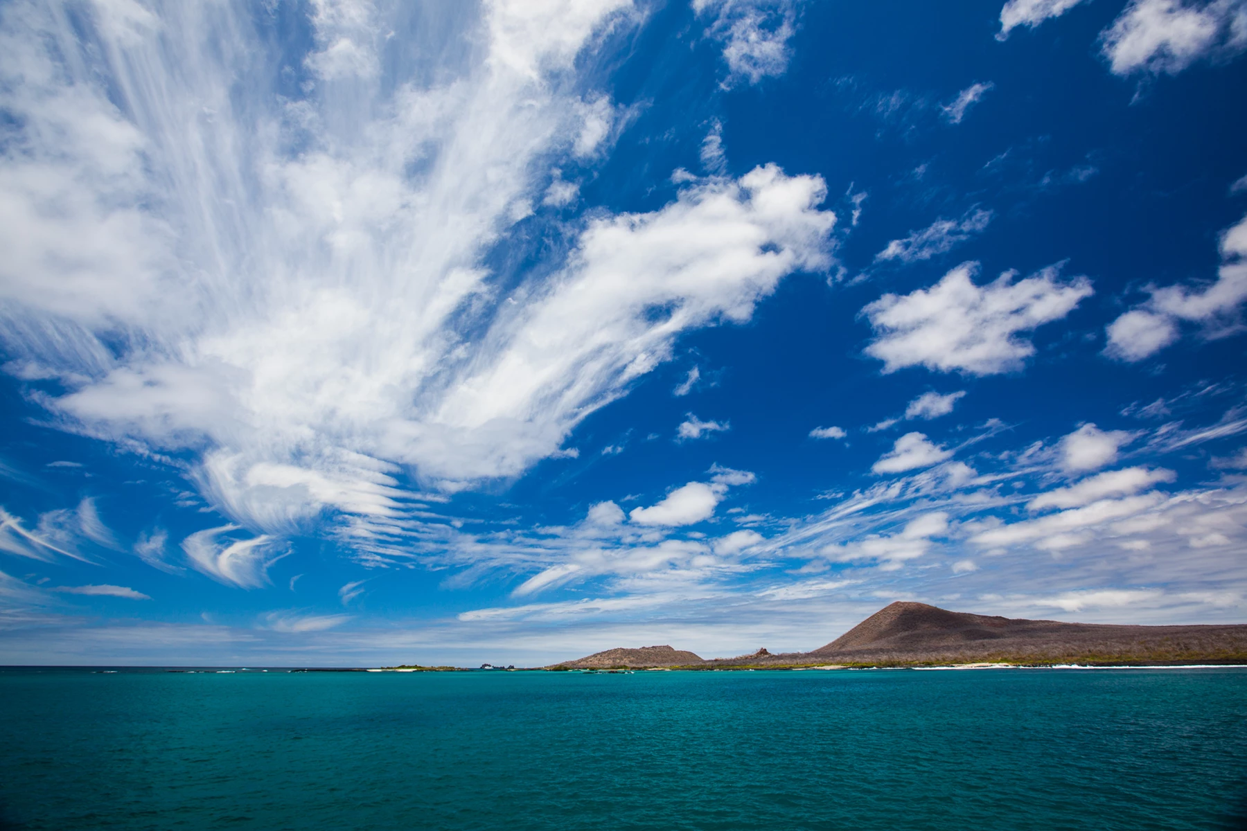 Colour photo of a body of water with land in the distance
