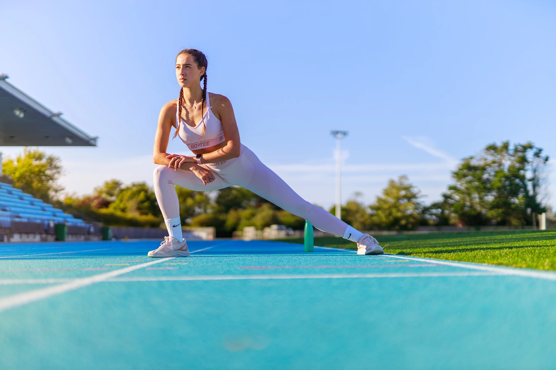 Colour photo of a person running on a track
